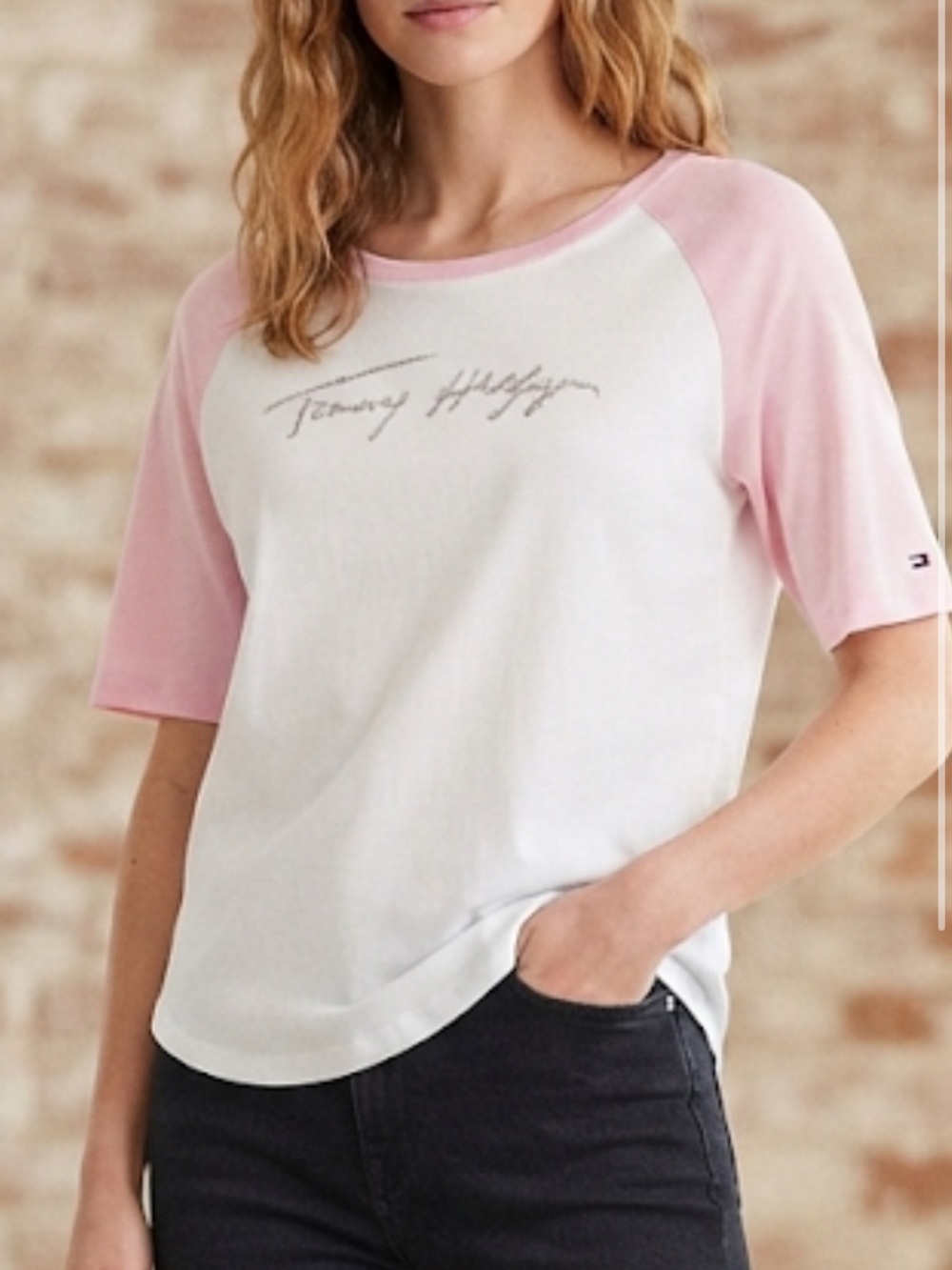 Hilfiger baseball tee features pink raglan sleeves silver script logo embroidery
